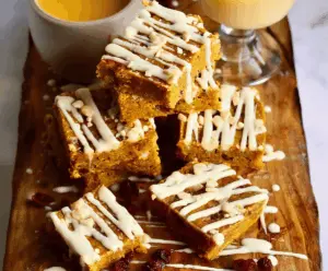 Delicious homemade pumpkin spiced bars topped with creamy white chocolate, perfect for fall desserts