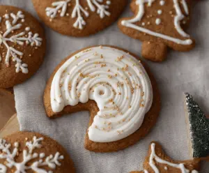 Delicious Crumbl Gingerbread Cookies on a festive plate with holiday decorations.