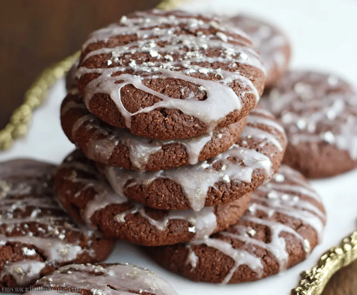 Delicious glazed chocolate gingerbread cookies on a festive plate, perfect for holiday treats.