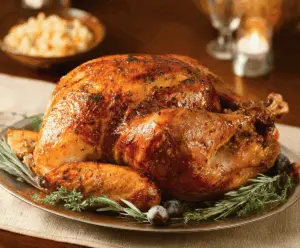 Juicy roasted turkey with crispy golden skin served on a platter for a festive meal.