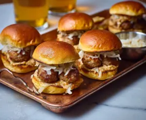 Delicious Beer Brat Sliders with melted cheese and savory sausage on slider buns