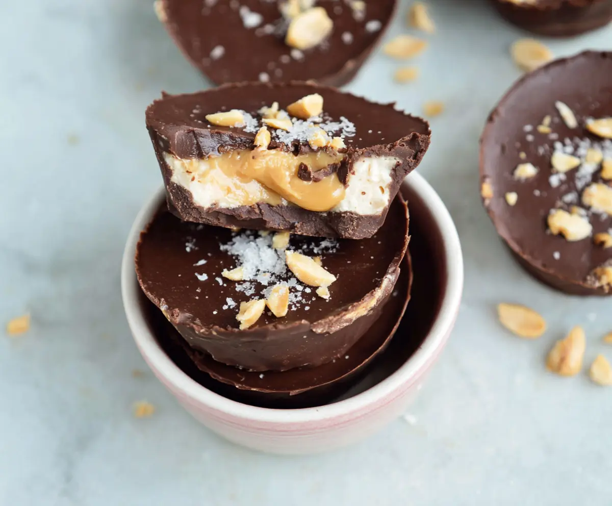 Delicious homemade Greek Yogurt Peanut Butter Cups with creamy peanut butter and smooth Greek yogurt coating