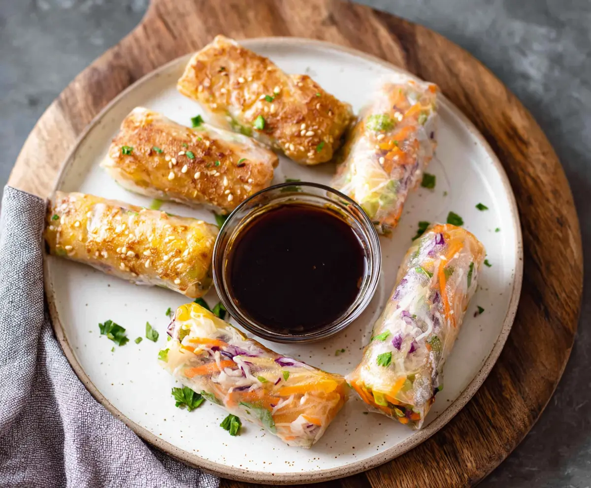 Delicious homemade air fryer rice paper rolls with fresh vegetables and herbs.