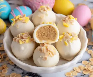 Delicious Banana Pudding Easter Truffles garnished with colorful sprinkles for festive celebration.