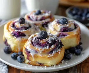 Delicious blueberry cheesecake rolls with creamy filling and fresh blueberries, perfect for dessert.