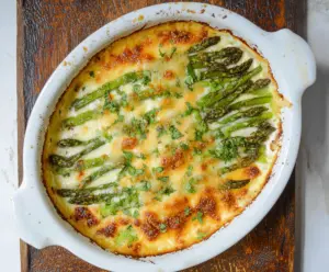 Delicious Cheesy Asparagus Bake with melted cheese and fresh asparagus, perfect for a healthy appetizer or side dish.
