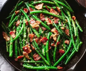 Delicious green beans cooked with crispy bacon for a flavorful side dish.