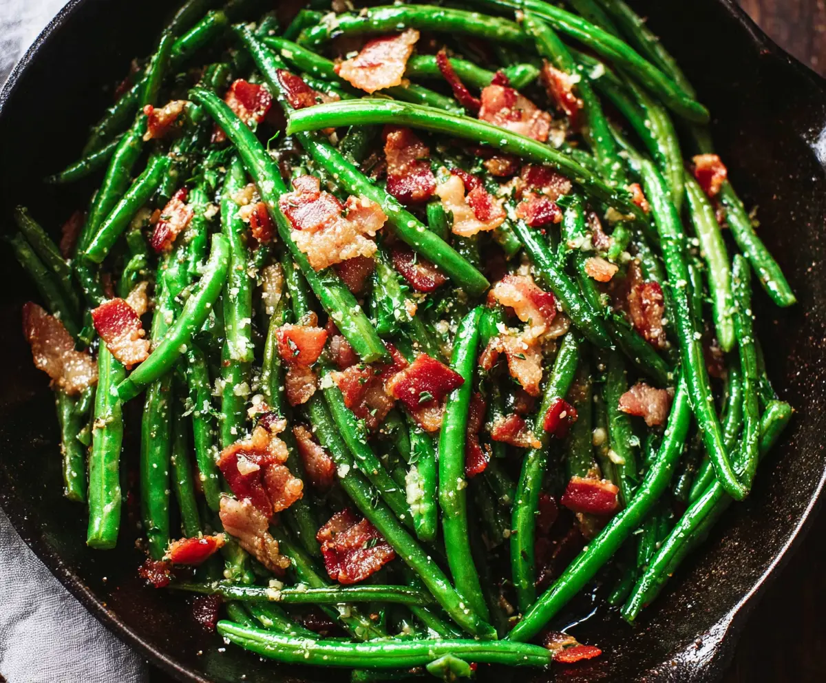 Delicious green beans cooked with crispy bacon for a flavorful side dish.