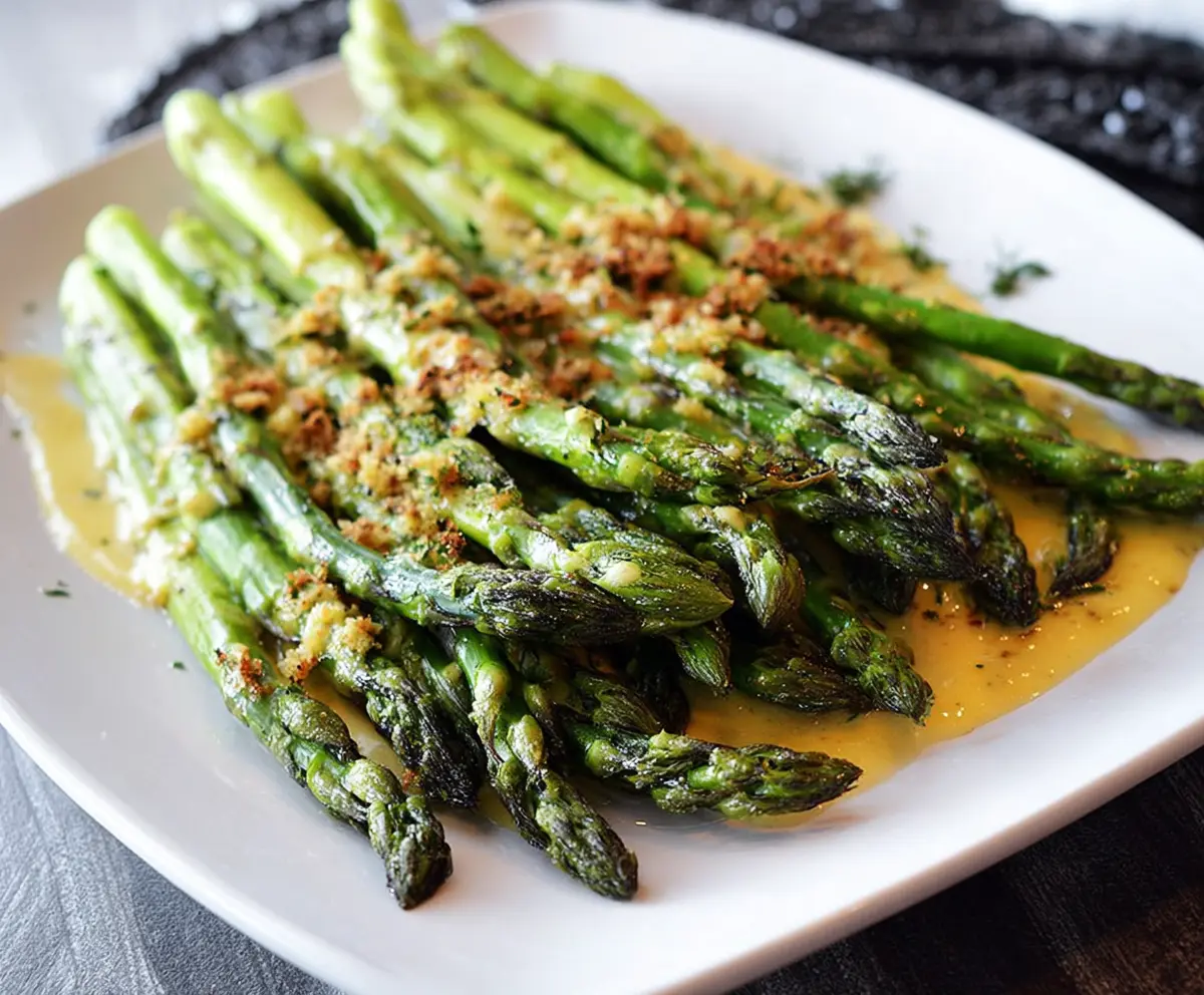 Delicious Honey Mustard Asparagus dish garnished with fresh herbs for a healthy side meal.
